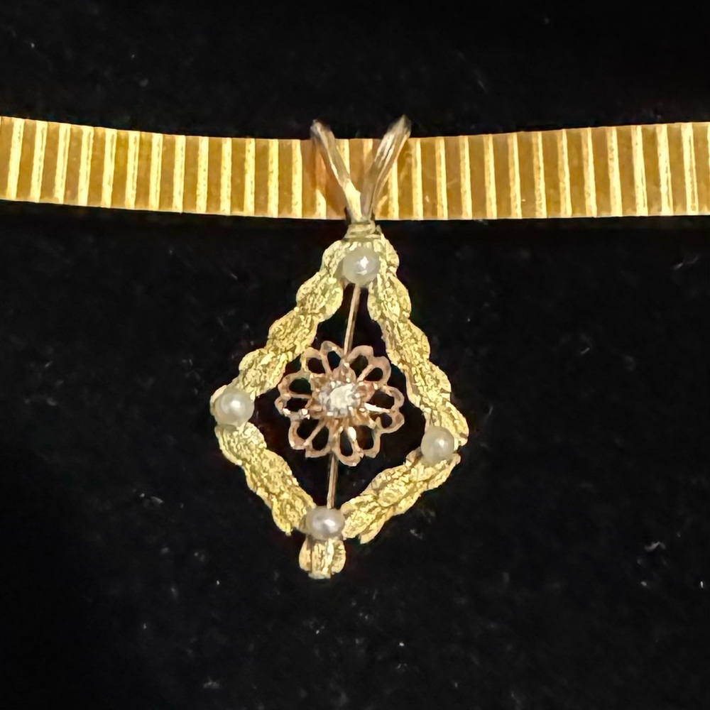 Seed pearl/diamond pendant.